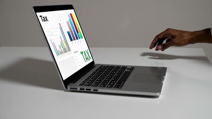 Poster - Accountant's hand approaches, hovers over, and then types on a laptop keyboard, interacting with tax related data displayed on the screen, set against a simple white background