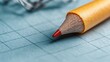 © Freshpixel - An intricate close-up of a colored pencil resting on gridded paper, emphasizing creativity and the artistic potential that lies in simple tools and daily inspirations.