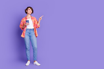 Poster - Full length portrait of nice young lady phone indicate finger empty space wear shirt isolated on purple color background
