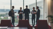 © Rizki - Blurred Business Team Meeting Office Window View