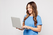 © ViDi Studio - Young smart Caucasian IT woman wears blue t-shirt casual clothes hold use work on laptop pc computer chatting online isolated on plain solid white color background studio portrait. Lifestyle concept.