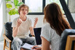 © Valerii Honcharuk - Teenage boy talking to female professional psychologist counselor therapist