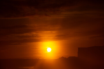 Wall Mural - a red sunrise glowing on the morning sky.