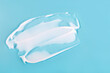 © Надія Сенько - White cosmetic cream smoothly spread in horizontal strokes on bright blue surface. Suitable for skincare ads, product textures, branding visuals or beauty marketing materials