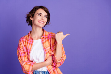 Poster - Photo of nice young girl look direct finger empty space wear shirt isolated on violet color background