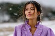 © Milos - A beautiful woman in violet attire stands gracefully amidst softly falling snow, embodying joy and warmth, surrounded by the serene beauty of a winter landscape.