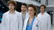 © Premium - group of medical professionals in white lab coats, showcasing collaboration and teamwork in modern healthcare environment. Their expressions reflect determination and focus