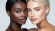 © mila103 - Two women with different skin tones are posing for a photo