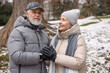 © New Africa - Lovely senior couple holding hands at winter park