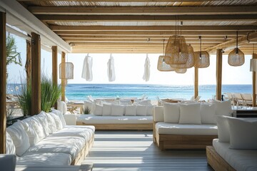 Wall Mural - a beach club lounge with white sofas and wooden structures, featuring an open-space design that over