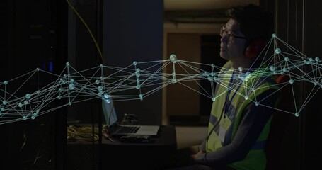 Poster - IT technician monitoring technology server rack, laptop wearing safety vest, floating network graph