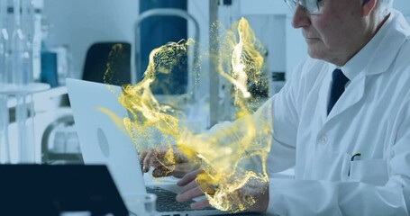 Poster - Senior scientist typing at research lab desk, with golden particle streams hovering above laptop