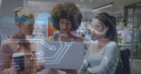 Poster - Three women collaborating around laptop in modern office, displaying animated finance graphs