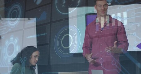 Poster - Man presenting while woman working on laptop in business meeting, showing digital charts overlay