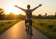 © GenAI Creations - Young man riding bicycle with arms raised at sunset on a scenic countryside road