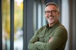 © Mark - Portrait of a confident middle-aged businessman standing in an office, a mature entrepreneur and CEO with a smiling face