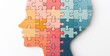 © Антон Сальников - A silhouette of a human head composed of multicolored puzzle pieces symbolizes the concept of cognitive functions and creative problem-solving