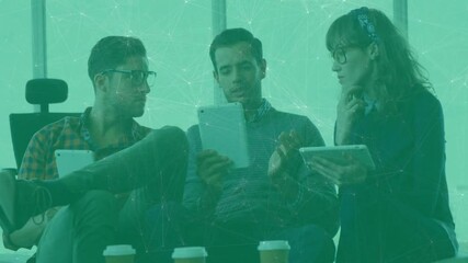 Poster - Three colleagues reviewing tablet content in business lounge, with floating data graphs overlay