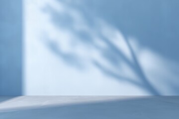 Poster - Soft blue wall with shadow of tree branches creating a serene atmosphere in a minimalist space, perfect for relaxation and calmness concept
