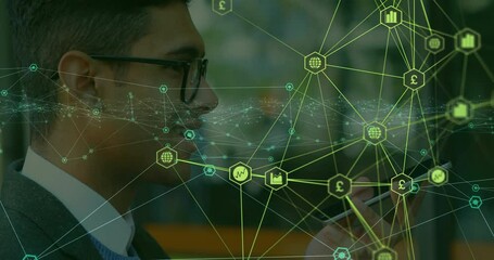 Poster - male business professional scrolling smartphone in office, displaying animated finance icons