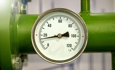 Poster - mechanical pressure sensor on pipeline. pressure gauge on green pipe. minimum pressure inside pipeli