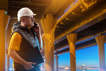 Poster - man road infrastructure architect. builders talking on phone. architectural engineer stands under br