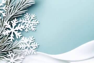 Wall Mural - christmas background featuring snow, snowflakes, and pine branches on light blue surface