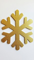 Poster - Sparkling golden snowflake ornament on white backdrop creating a festive winter holiday atmosphere perfect for seasonal greetings and elegant design projects