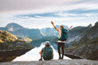 © EVERST - Couple friends traveling in Norway man and woman hiking enjoying Lofoten islands view, active vacations healthy lifestyle recreation trip outdoor family backpackers adventure climbing tour