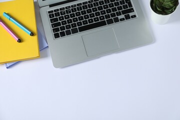 Aufkleber - Office supplies, laptop and houseplant on white table, flat lay. Space for text