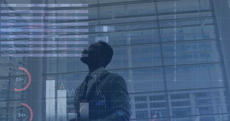 Poster - Image of data processing over african american businessman walking