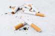 © New Africa - Many cigarette butts on light background, closeup