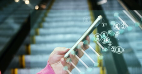 Poster - Image of media icons and dna strand over biracial businesswoman using smartphone