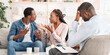 © Prostock-studio - Marriage crisis. Young black spouses arguing at family therapy session, sitting on couch at counselor's office, free space