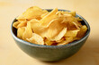 © The Picture Pantry - Bowl that holds golden and crispy chips fries.