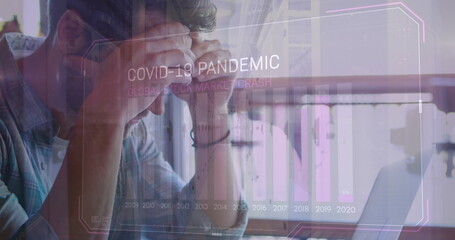 Poster - Image of covid 19 data processing and statistics over worried caucasian man using laptop
