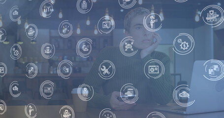 Poster - Image of connections with technology icons over caucasian woman using laptop
