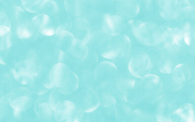 Blue green turquoise bokeh texture background. Concept for Winter season, Snowfall, New Year, Christmas and All Celebrations.