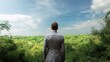 © WS Studio 1985 - Businessman Standing with Back to Camera Overlooking Lush Landscape