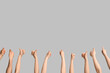 © Pixel-Shot - Many hands showing thumbs-up on light background