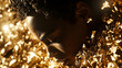 © AENI - Close-up portrait of a person shrouded in golden flakes.