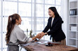 © David - Two lawyers in suits discussing legal matters at a desk with a gavel, scales of justice, and a law book, symbolizing law and justice, justice and lawyer Business partnership meeting concept.