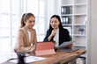 © David - Asian company employees and colleagues work together in the office. Doing accounting analysis report real estate investment data, Financial and tax systems concept.