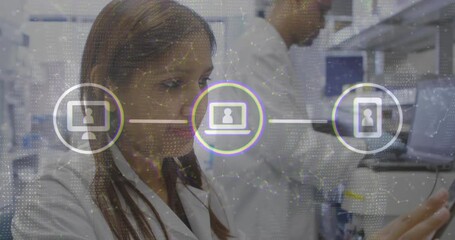 Poster - female scientist analyzing data at tech lab bench overlaying network graphics with device icons