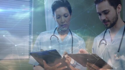 Poster - doctors reviewing clipboard and tapping tablet in health clinic, adding network overlay