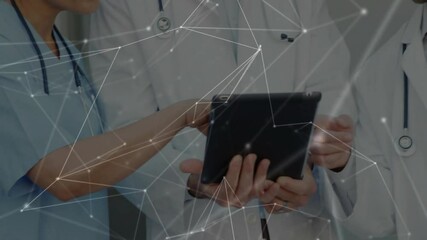 Poster - Healthcare professionals collaborating on tablet in hospital, displaying animated network overlay