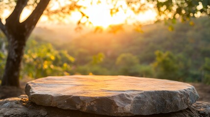 Poster - Close-up view of a rustic stone pedestal in a tranquil outdoor setting, highlighted by gentle lighting and surrounded by lush trees and foliage
