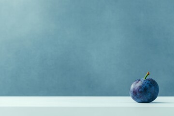 Poster - A solitary acai berry showcases its deep purple tones against a white surface illuminated by soft natural light, ideal for design with open space on the left
