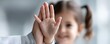 © Wimon - A child's hand raised high, met by a doctor's hand in a cheerful high five; a moment of connection - appreciation professional cheerful