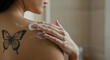 © StockWorld - Butterfly Tattoo & Luxurious Lather: Woman Washing with Gentle Soap, Skin Care Beauty, Body Wash Routine, Self-Care Ritual